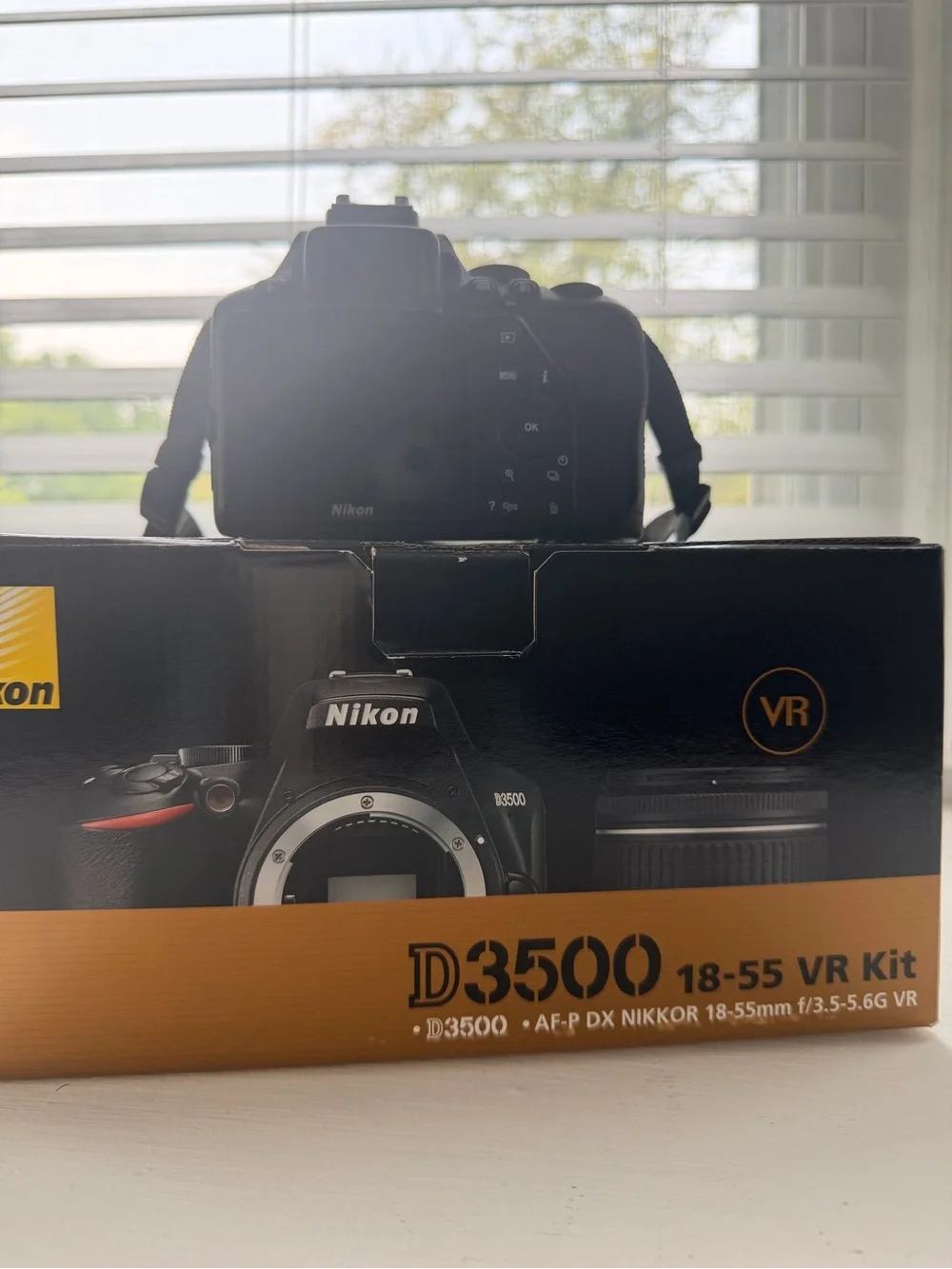 Nikon D3500 DSLR Camera Kit in Black with Orange Accent
